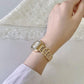 Golden Roman Numeral Dial Watch